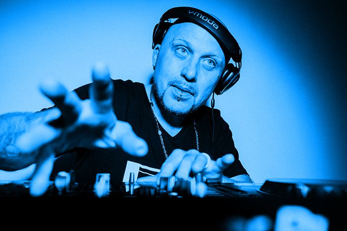 Dan-E reaching for the mixer, lit in blue